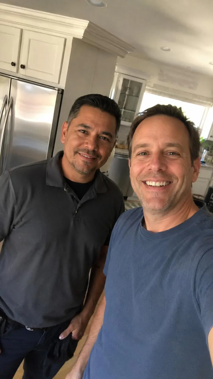 Escondido Appliance Repair technician with a happy customer after a kitchen repair